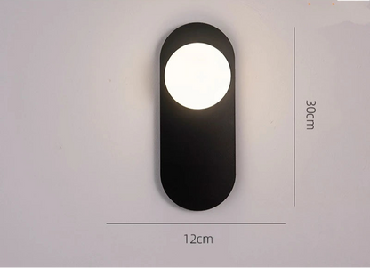Applique murale ovale minimaliste or diffusant une lumière LED douce et chaleureuse