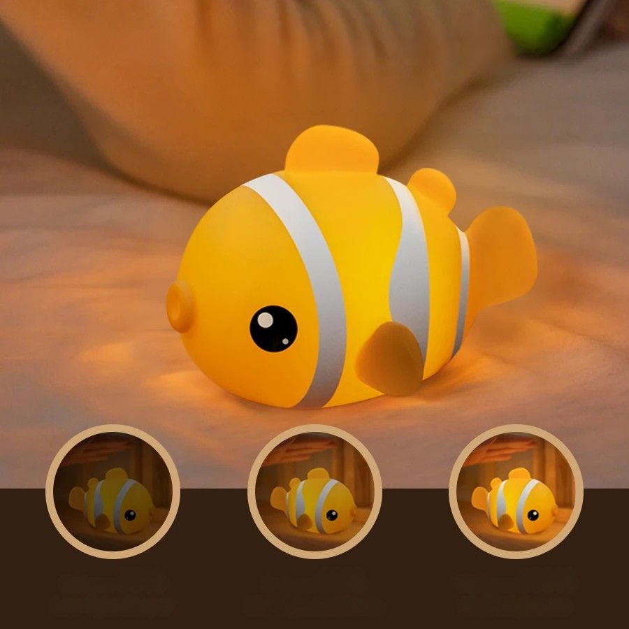 Veilleuse enfant poisson clown vue de face avec lumière douce orange et blanche